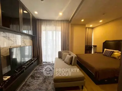Luxurious bedroom with elegant decor and large window offering natural light