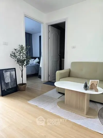 Modern living room with stylish decor and cozy bedroom view