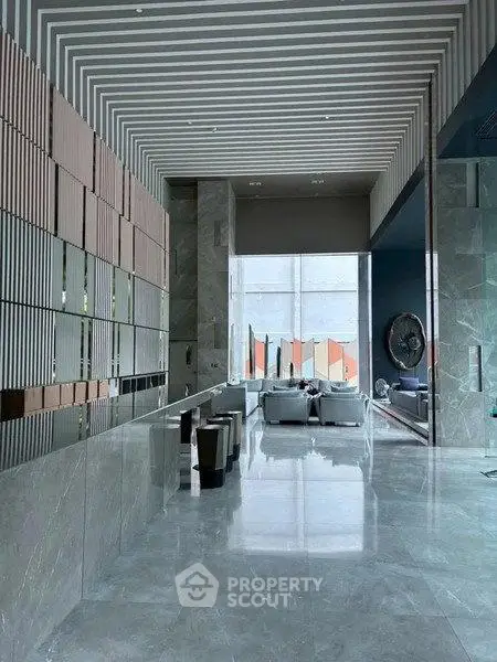 Luxurious modern lobby with sleek marble floors and stylish seating area
