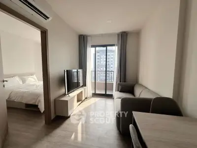 Modern apartment living room with balcony view and cozy furnishings
