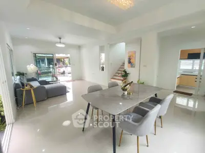 Spacious modern living and dining area with elegant decor and natural light