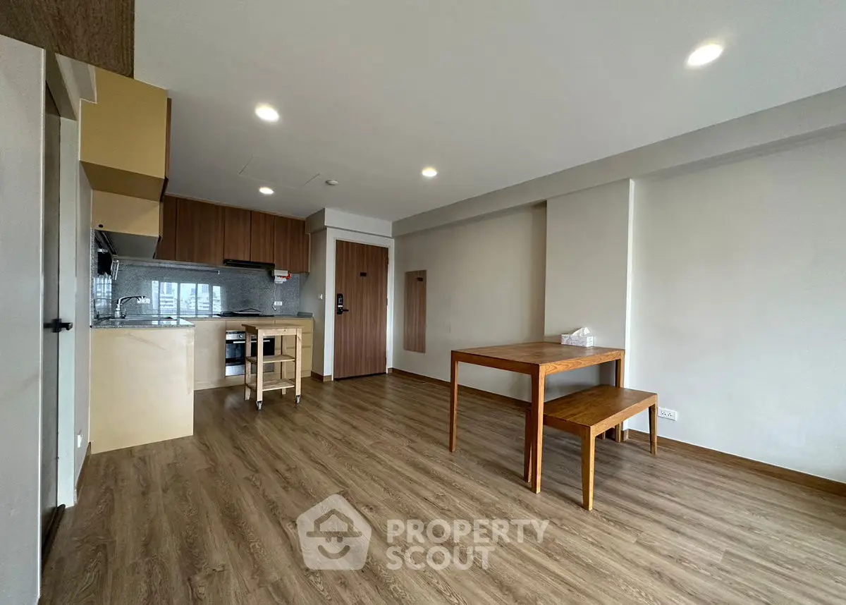 Spacious modern apartment with open kitchen and wooden flooring