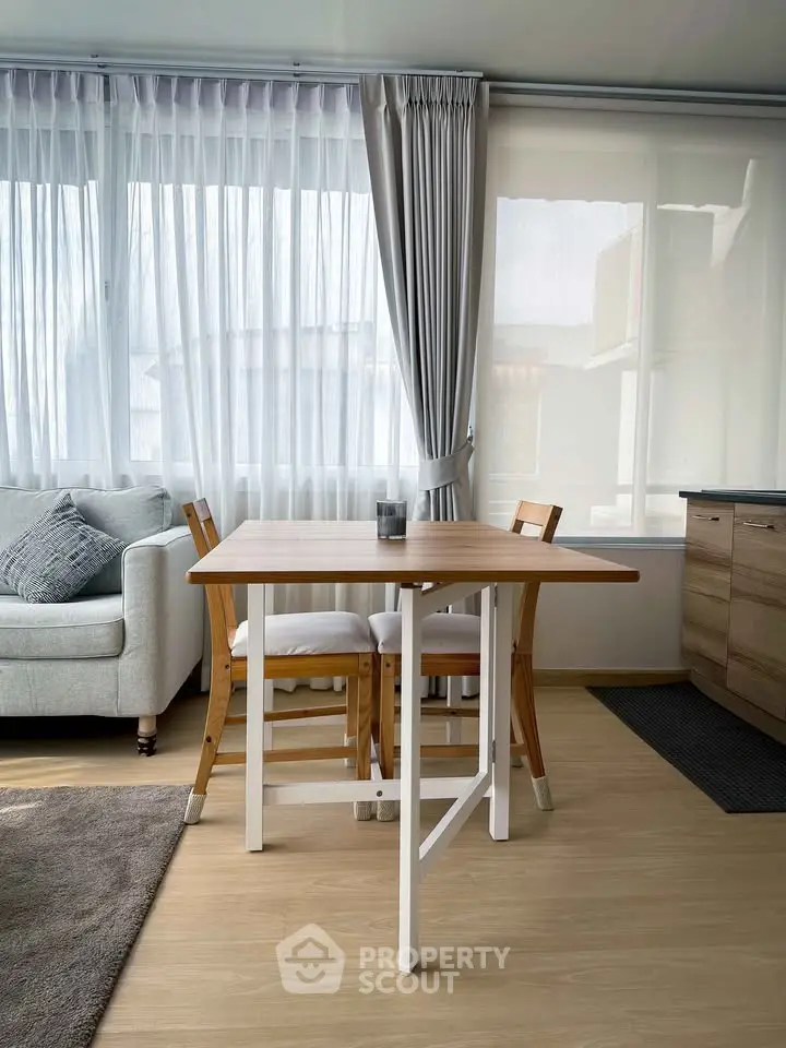 Bright living room with modern furniture and large windows