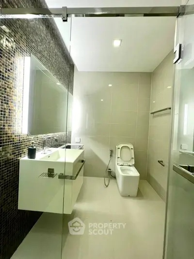 Modern bathroom with sleek design and glass shower enclosure