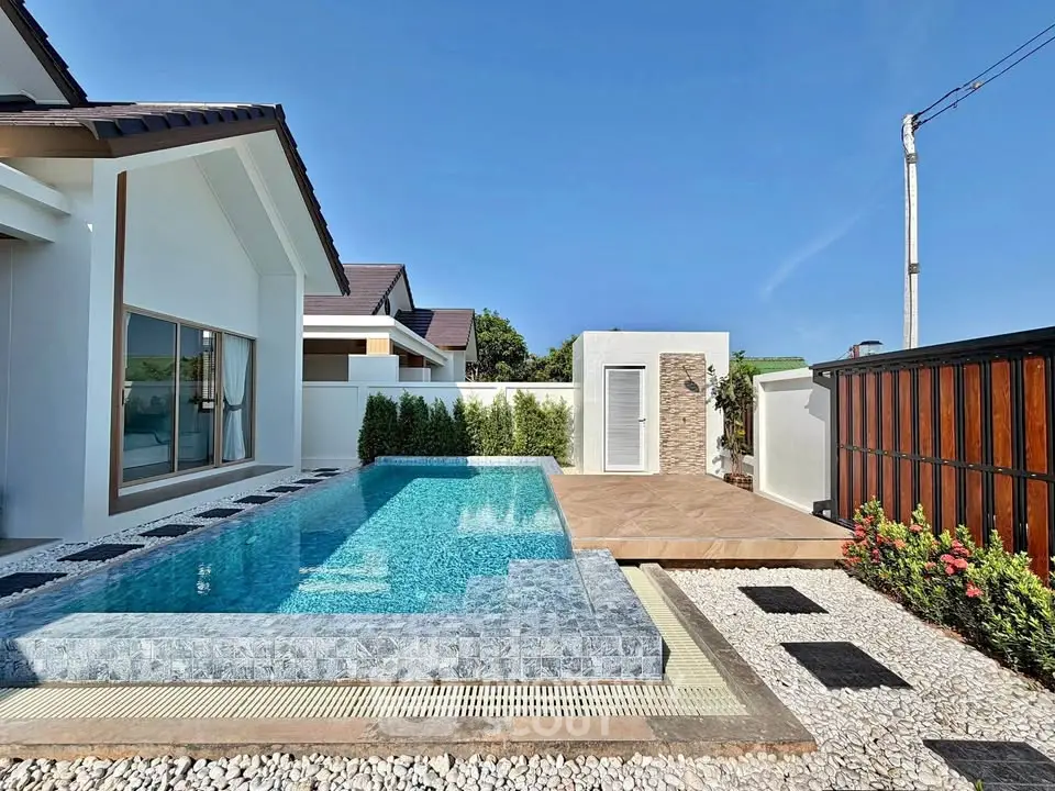 Luxurious modern home with stunning private pool and elegant outdoor space.