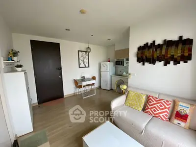 Charming living room with modern decor and cozy seating in a stylish apartment.