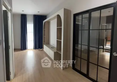 Modern bedroom with sliding glass doors and natural light