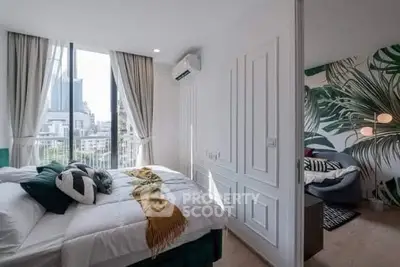 Modern bedroom with large windows and stylish decor in urban apartment