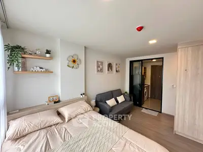 Modern bedroom with cozy decor and adjacent laundry area