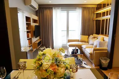 Stylish living room with modern decor and large windows offering natural light.