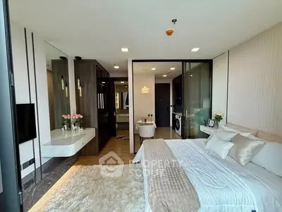 Luxurious modern bedroom with ensuite bathroom and stylish decor, featuring a cozy bed and elegant furnishings.