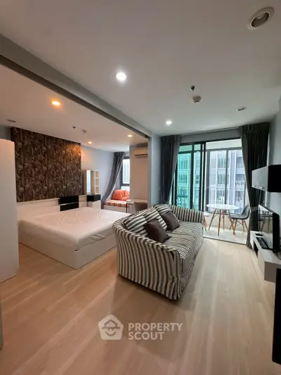 Spacious modern studio apartment with balcony and stylish decor