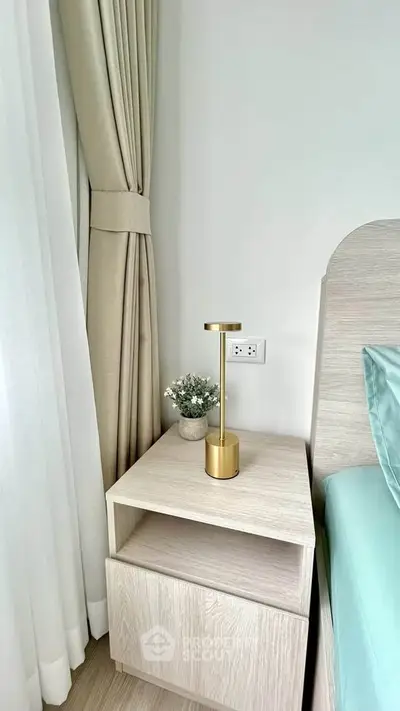 Modern bedroom corner with elegant bedside table and stylish lamp