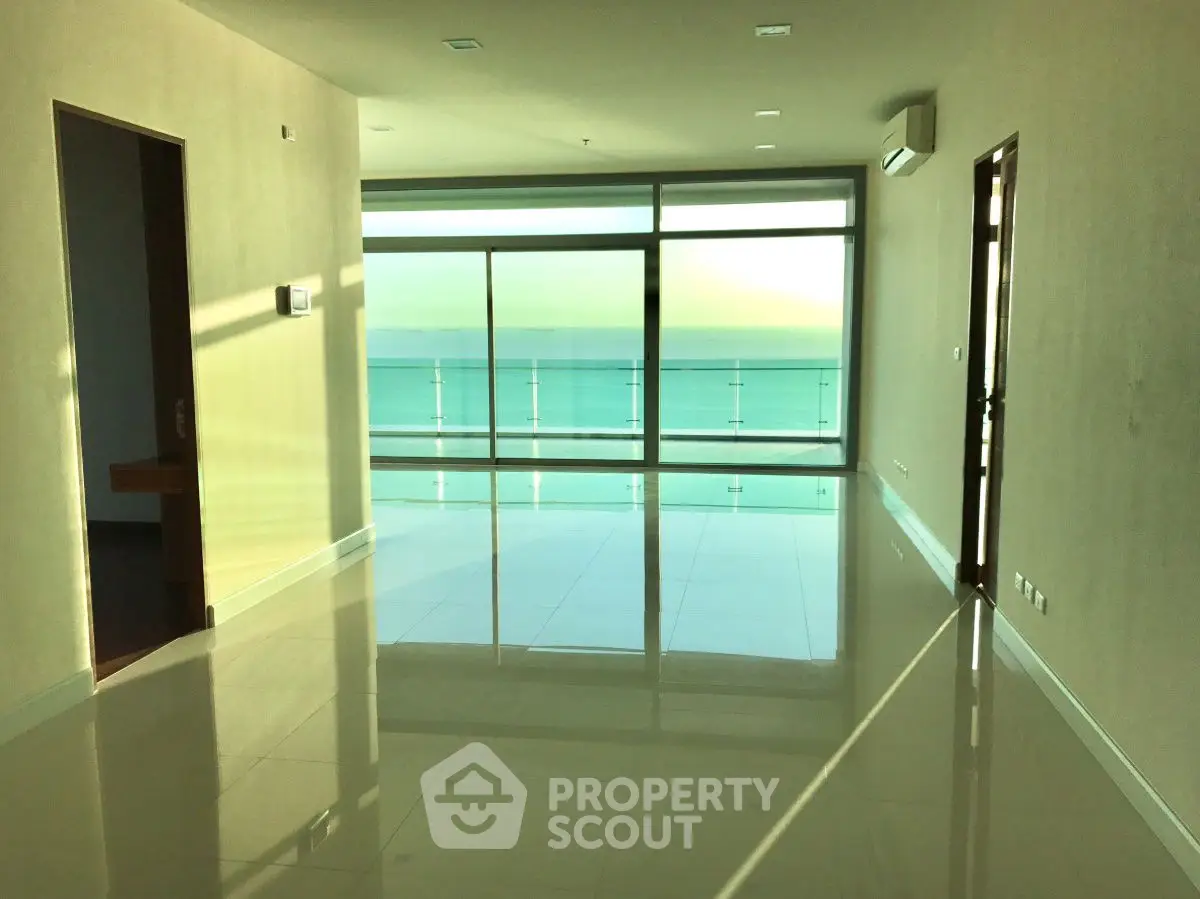 Spacious living room with stunning ocean view and large windows