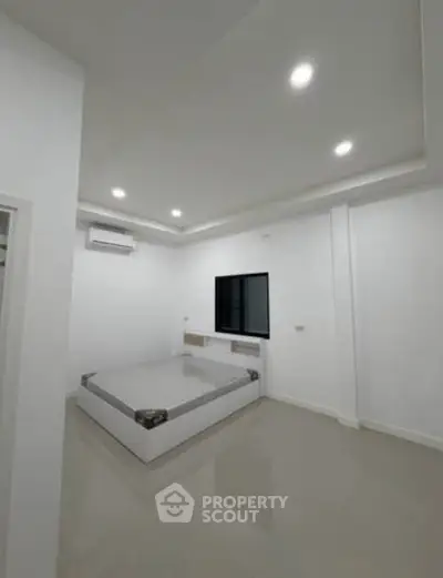 Modern minimalist bedroom with sleek design and ambient lighting