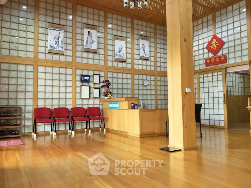 Spacious lobby with wooden flooring and traditional decor, ideal for welcoming guests.