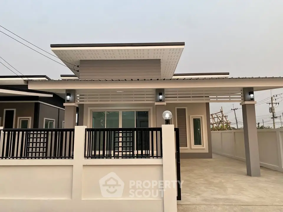 Modern single-story house with sleek design and spacious driveway