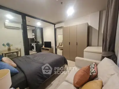 Modern studio apartment with cozy bedroom and open living area