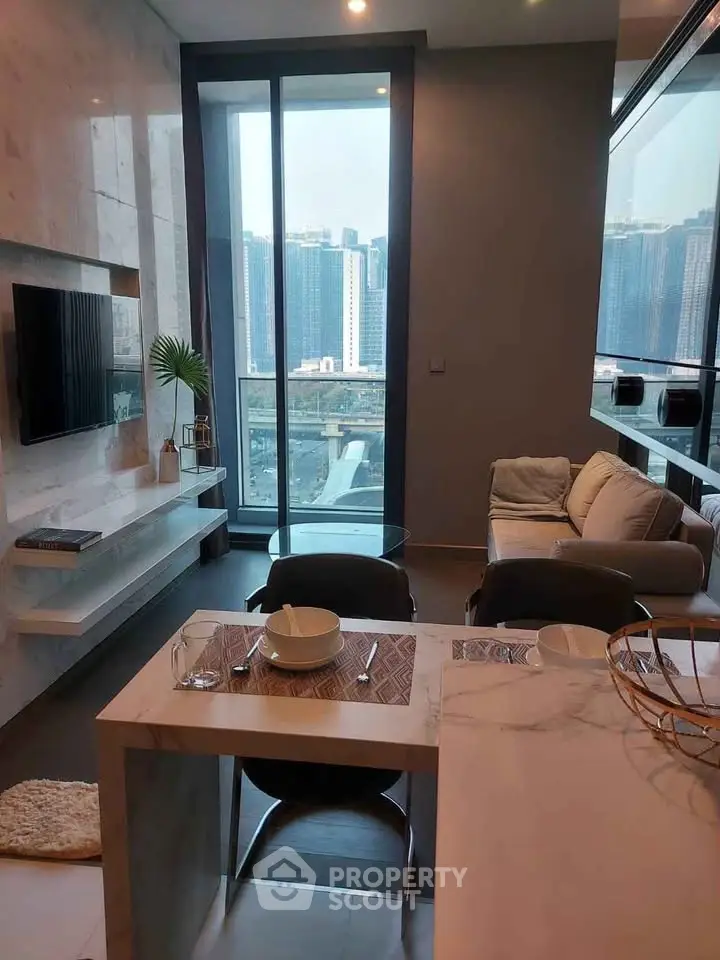 Modern living room with city view, featuring sleek furniture and open layout, perfect for urban living.