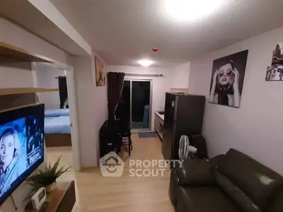 Modern apartment interior with cozy living room and kitchen, featuring stylish decor and open layout.