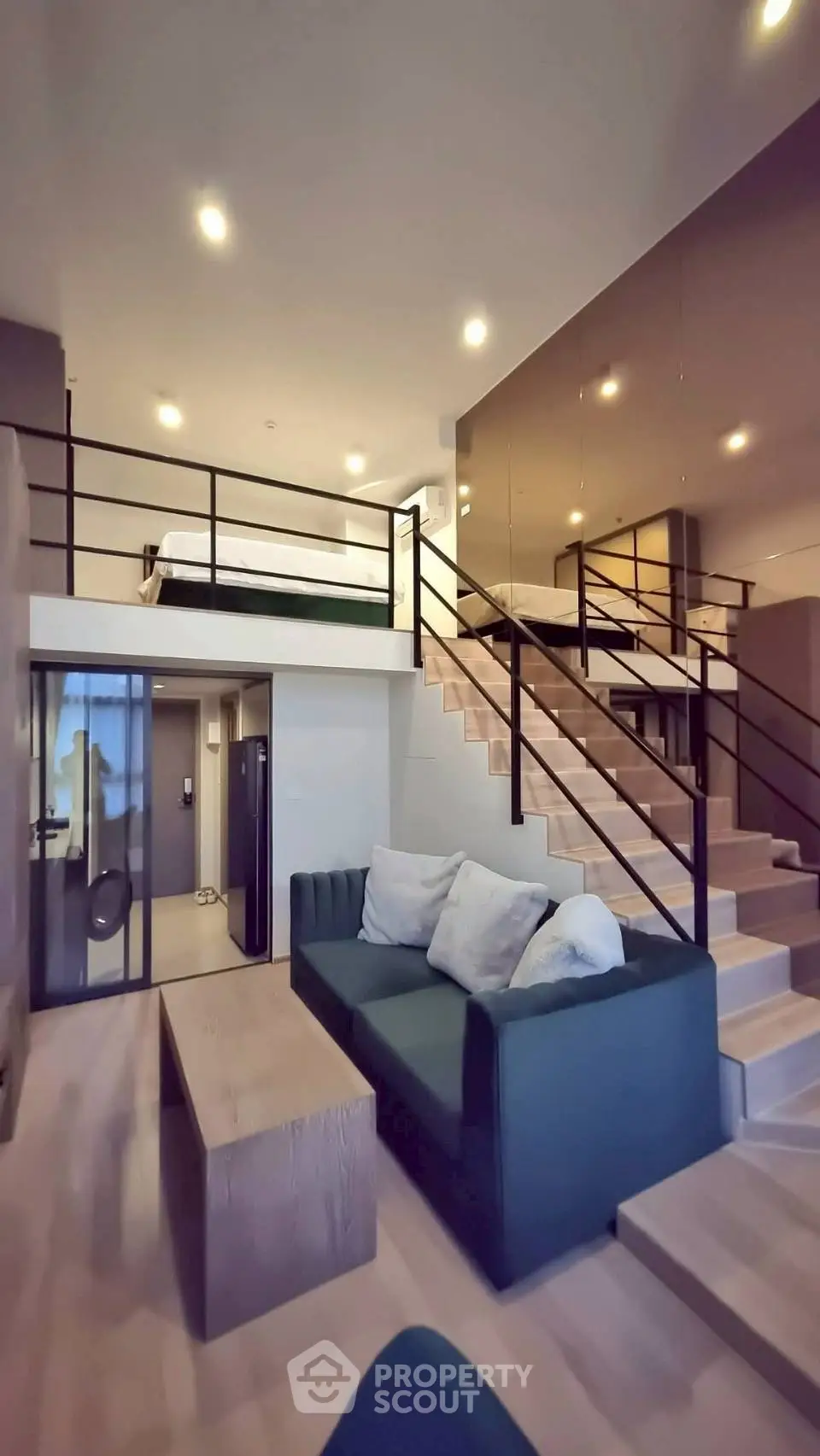 Modern loft apartment with stylish mezzanine and cozy living area