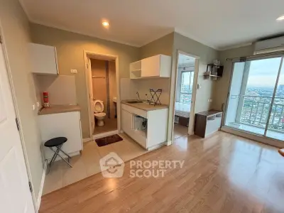 Modern apartment interior with open kitchen and city view balcony