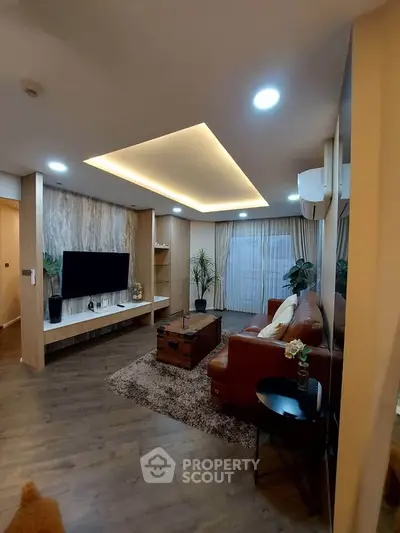 Modern living room with stylish decor and ambient lighting