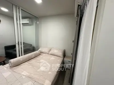 Modern bedroom with glass partition and cozy decor