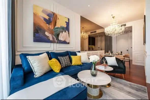 Luxurious living room with elegant decor and plush blue sofa