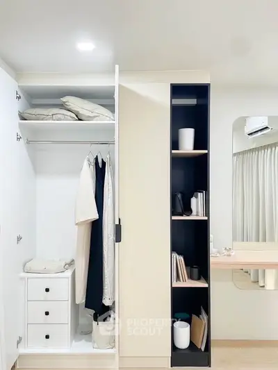 Modern bedroom with sleek wardrobe and minimalist decor