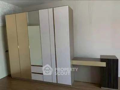 Spacious bedroom with modern wardrobe and sleek design