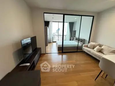 Modern studio apartment with glass partition and city view