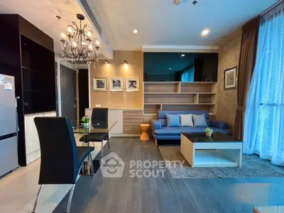 Modern living room with elegant decor and open dining area