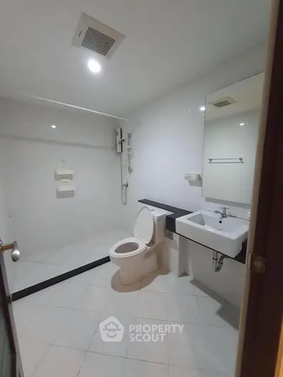 Modern bathroom with sleek fixtures and spacious layout, ideal for contemporary living.