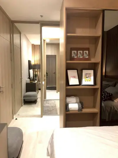 Modern bedroom with stylish decor and ample storage space