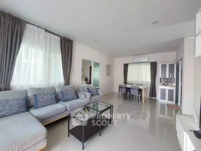 Spacious modern living room with elegant decor and ample natural light