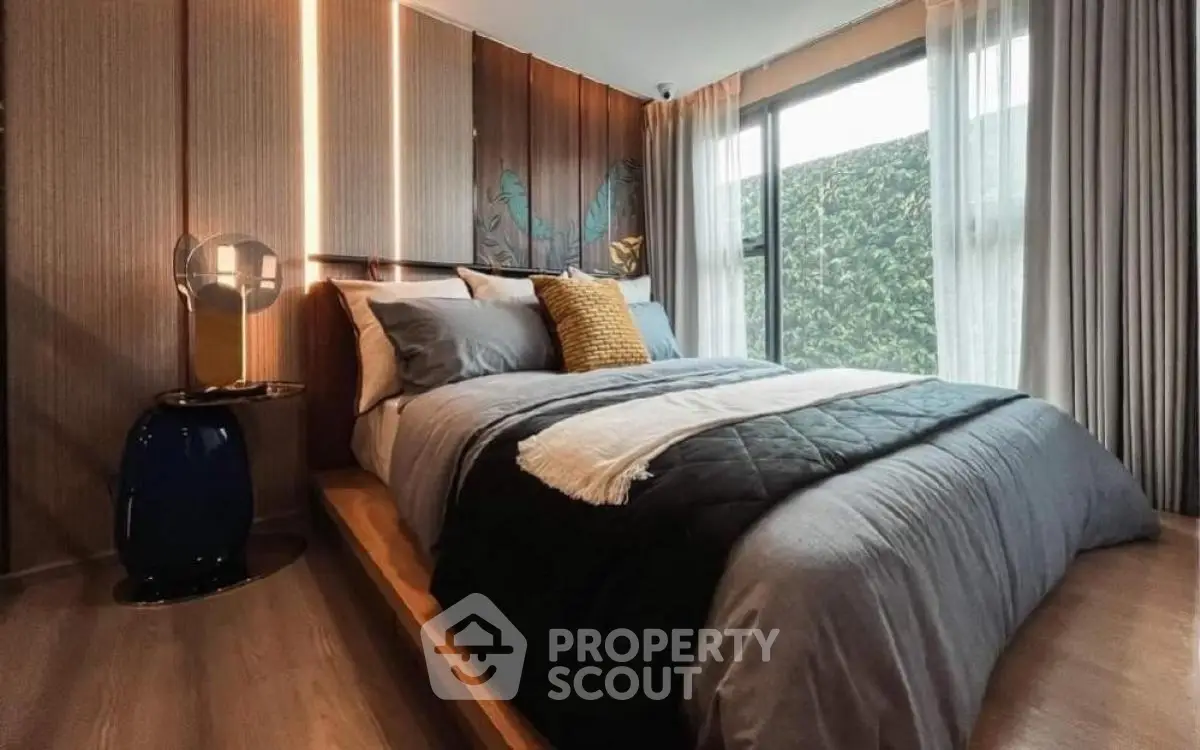 Luxurious modern bedroom with elegant decor and large window view
