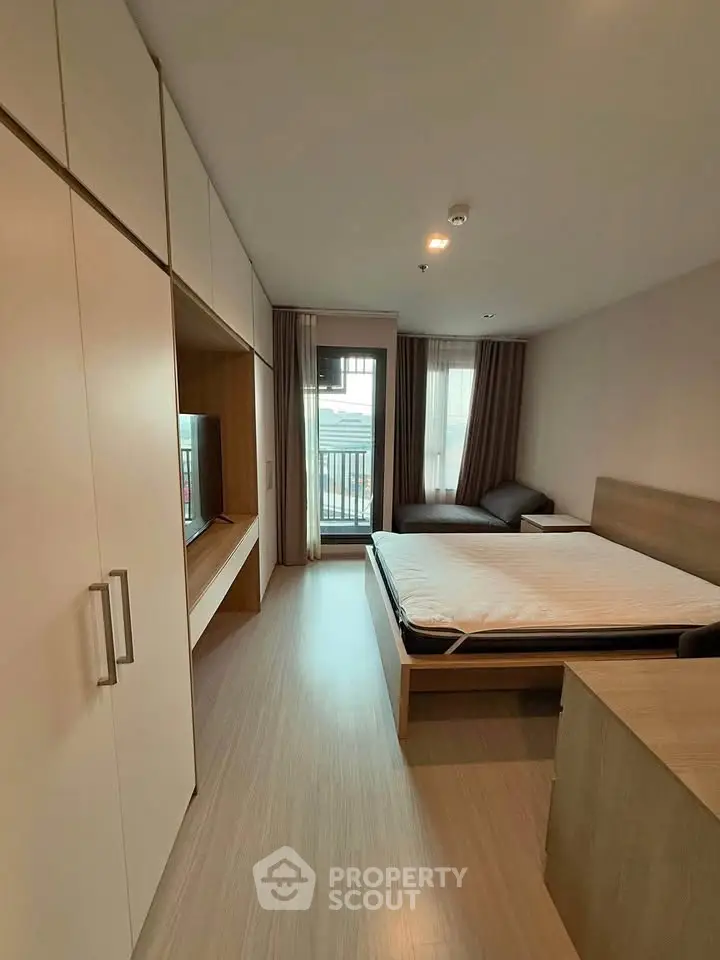 Modern bedroom with sleek design, featuring built-in wardrobe and cozy ambiance.