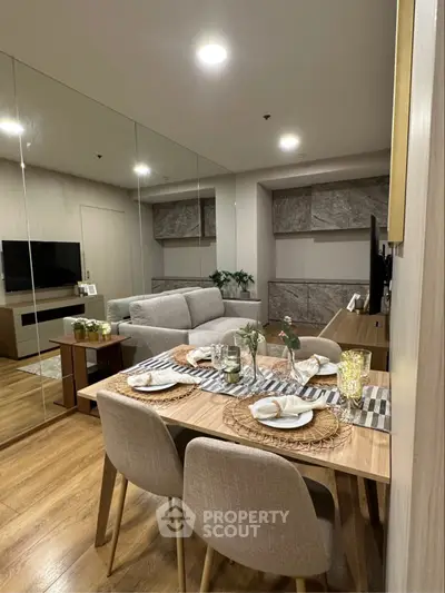 Modern living room with dining area, stylish decor, and cozy ambiance