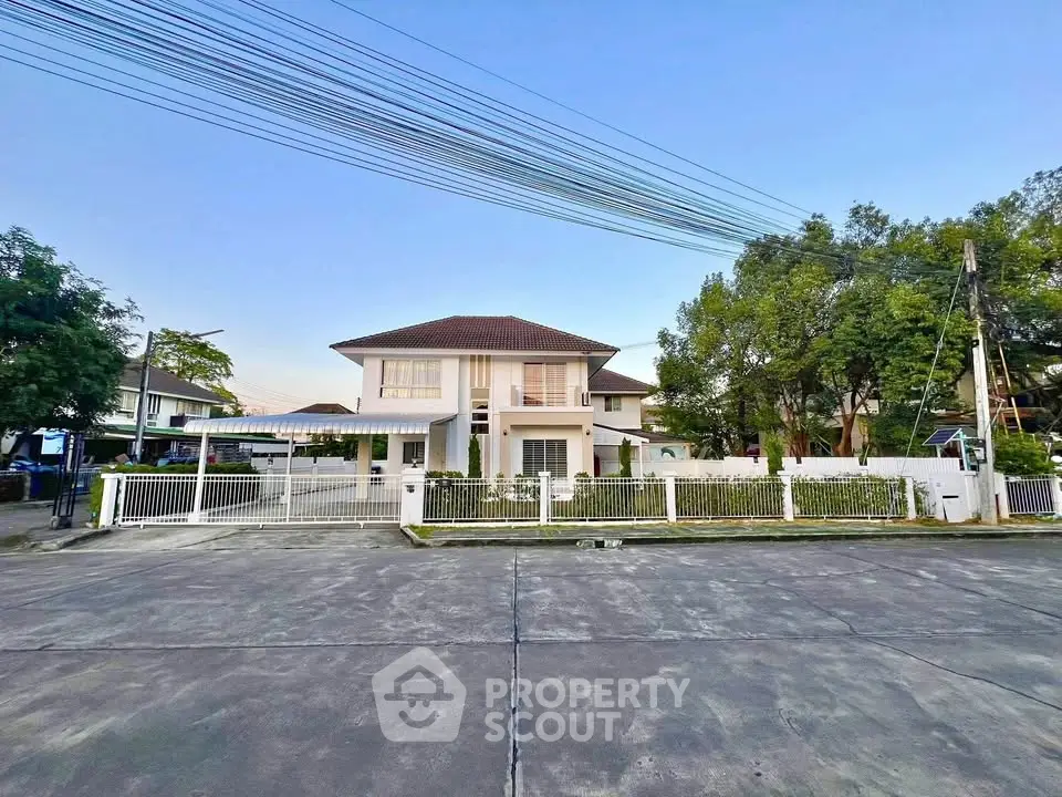 Charming two-story house with spacious front yard and modern design in a serene neighborhood.