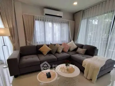 Elegant living room with modern gray sofa and stylish decor