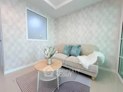Stylish living room with modern decor and cozy sofa in a bright interior setting.