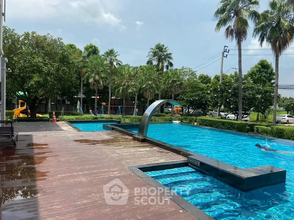 Luxurious outdoor pool area with lush greenery and modern design, perfect for relaxation and leisure.