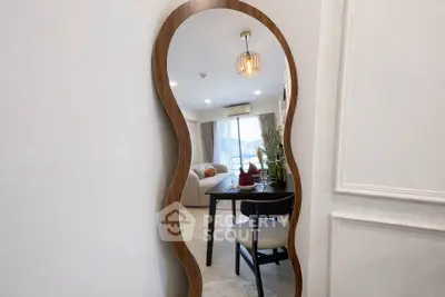 Stylish living room with modern decor and unique mirror design