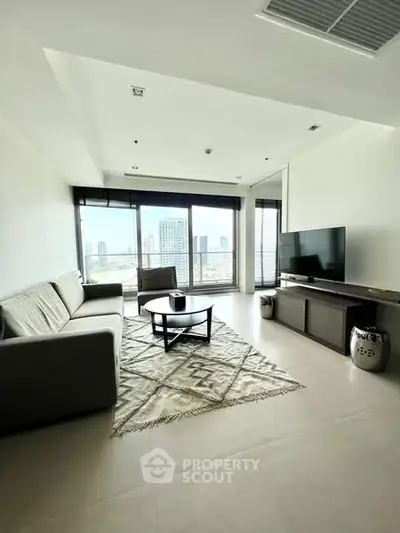 Spacious modern living room with city view, large windows, and stylish decor.