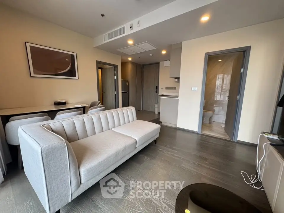 Modern living room with sleek furniture and open layout, perfect for urban living.