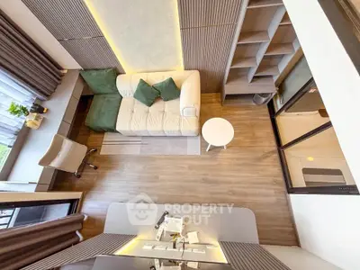 Modern living room with stylish decor and cozy seating area, perfect for relaxation and entertainment.