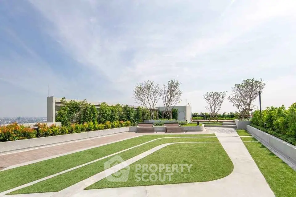 Stunning rooftop garden with lush greenery and modern design, offering panoramic city views.
