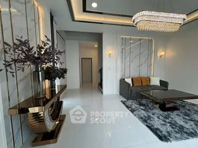 Luxurious living room with elegant chandelier and modern decor