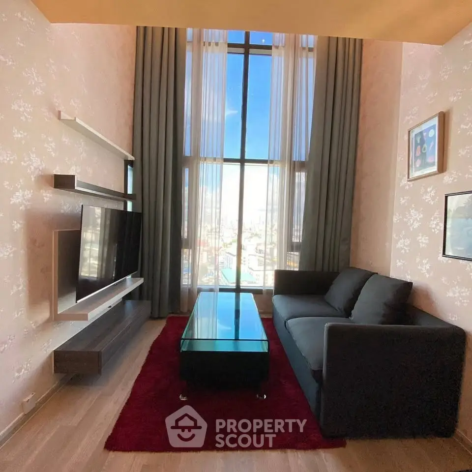 Modern living room with high ceiling and large window view